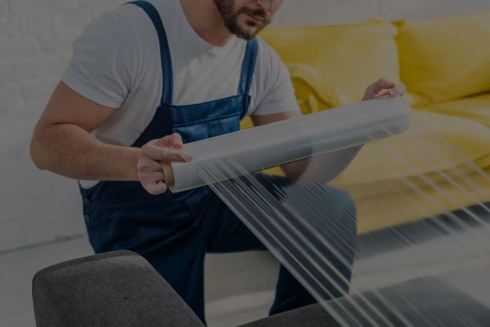 a photo of using stretch wrap film